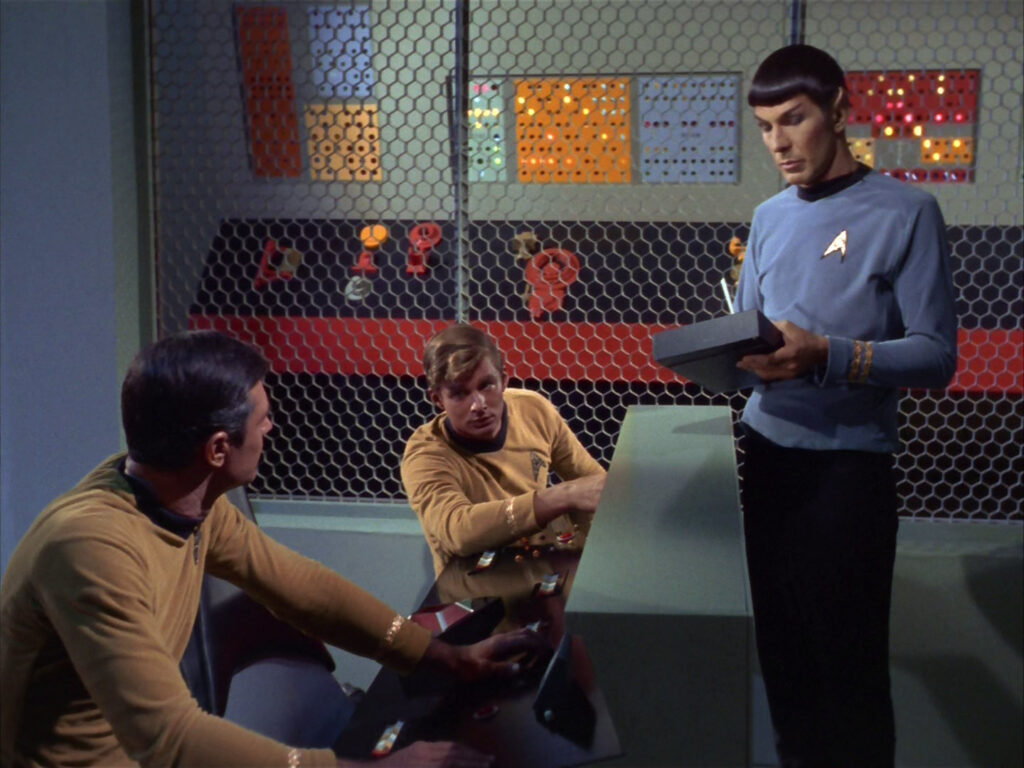 Spock offers help to Stiles and Tomilson.